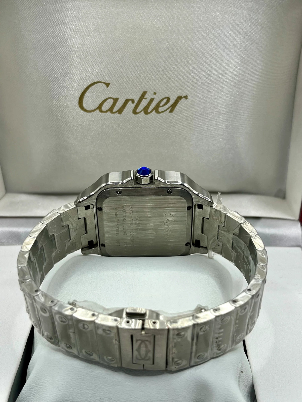 Montre Santos à lunette bleue, cadran blanc et acier inoxydable