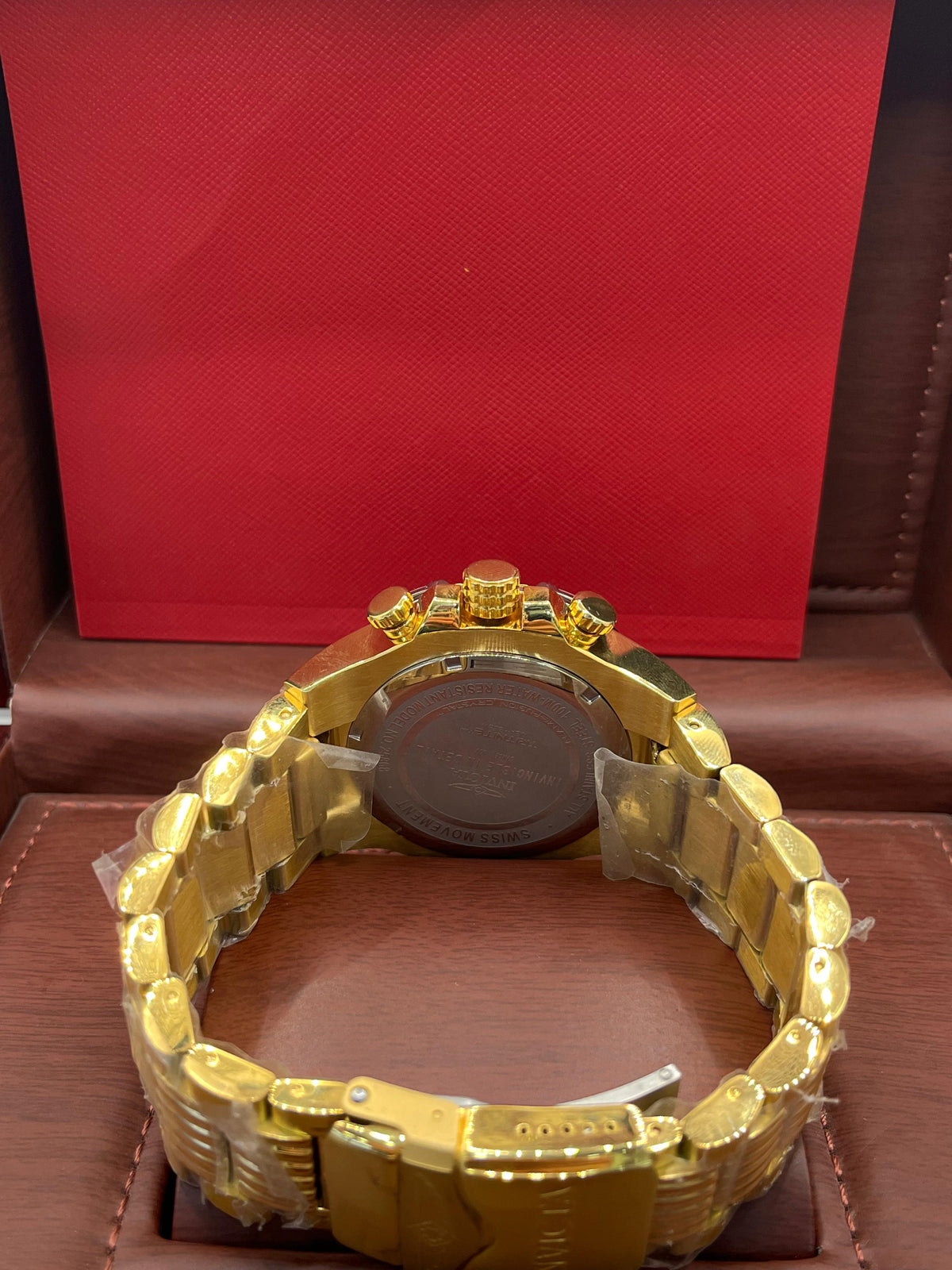 Montre chronographe dorée et verte