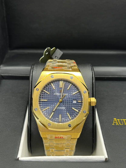 Montre dorée à cadran bleu